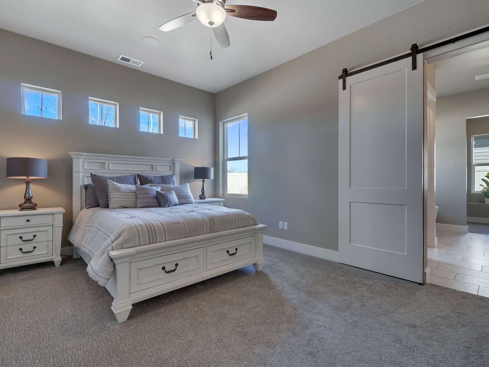 Modern Master Bedroom Staged With New White Furniture